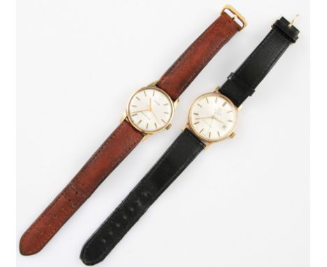 A 9ct yellow gold cased Tudor wrist watch, the silver tone dial having hourly baton markers with minute track border, case ha