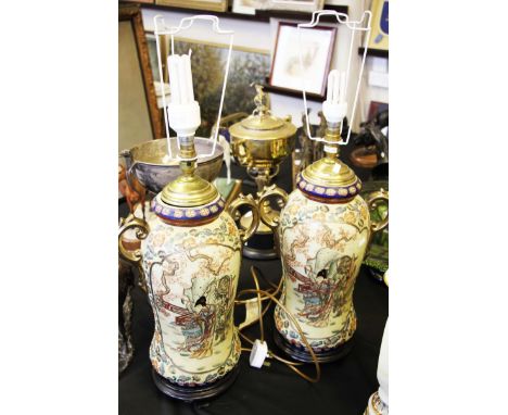 A pair of Japanese Satsuma pottery lamp bases with figural and floral decoration.