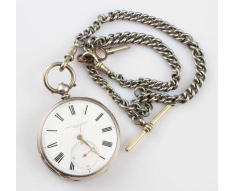 A white metal key wind open face pocket watch, the white enamel dial having hourly Roman numeral markers with minute track bo