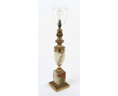 An onyx and gilt lamp base with ornate decoration.