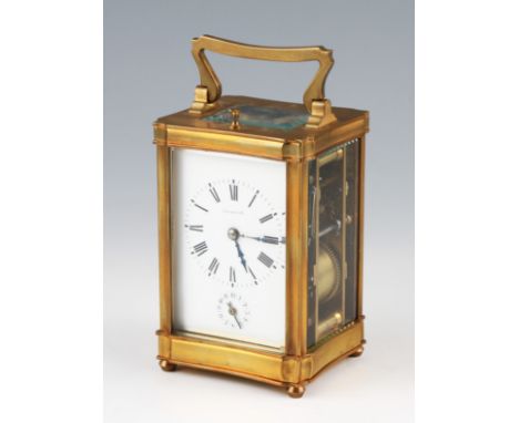An early 20th Century Tiffany & Co alarm repeat carriage clock, with striking gong the brass body having bevelled edged glass