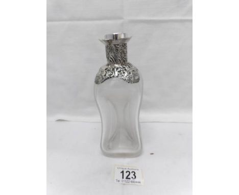 A small silver topped decanter (stopper a/f)