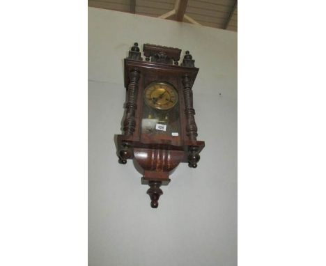 A mahogany wall clock