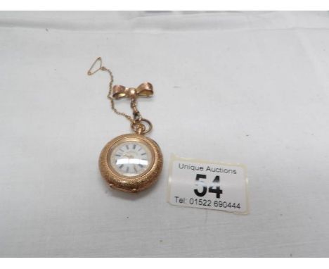 An early 19th century 14ct gold ladies fob watch in chased gold with enamel face surmounted by a ribbon with safety chain in 