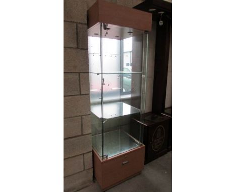 A glass shop display cabinet with light