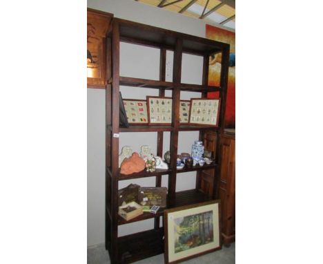 A good quality solid mahogany shelf unit