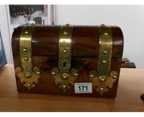 A Victorian dome top walnut brass banded tea caddy