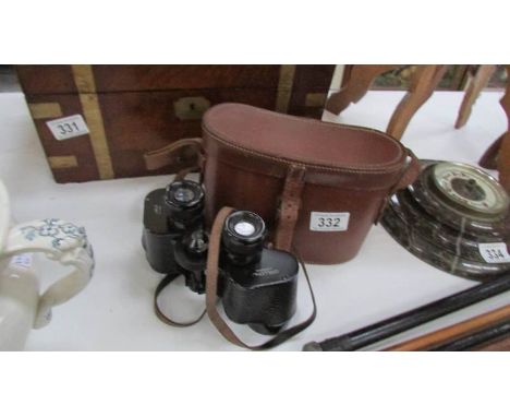 A leather cased set of 8 x 40 binoculars by Dolland, London