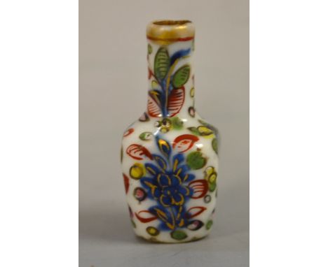 An early 18th century miniature Chinese tapering square bottle vase, probably from a contemporary doll's house, decorated in 