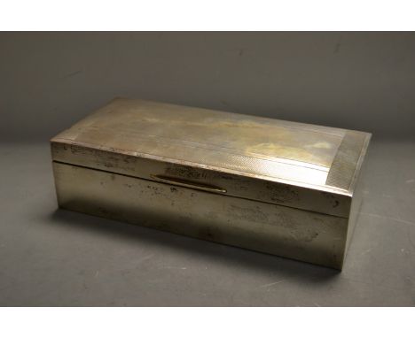 A rectangular silver engine turned cigarette box, cedar lined, Birmingham 1960, 18.5cm wide