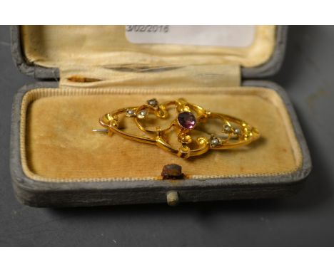 A Victorian 9ct gold pearl and garnet set brooch, cased
