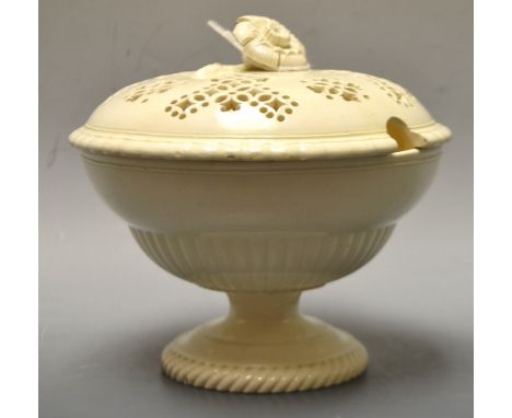 A Leeds creamware urnular pedestal sauce tureen and cover, pierced fretwork cover with flower and sprig finial, the tureen wi