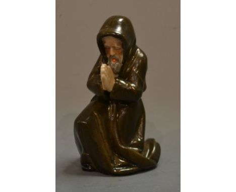 A rare Royal Worcester/ Kerr and Binns candle snuffer, Kneeling Monk, praying, in brown and flesh tones, 10cm high, unmarked,