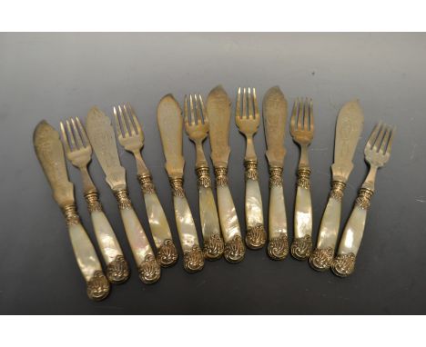 A set of six pairs of late Victorian silver mounted mother of pearl and E.P.N.S fish knives and forks, the leafy scroll mount