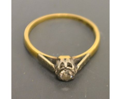 A diamond solitaire ring, round brilliant cut, approx 0.15ct, platinum claws, 18ct yellow gold shank, size M, 1.7g gross