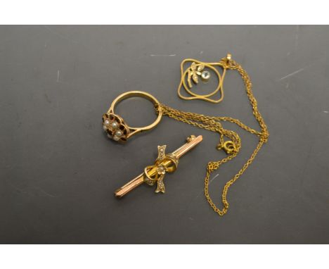 An early 20th century 9ct gold pendant and chain, impressed square pendant set with a single pale blue aquamarine and three s