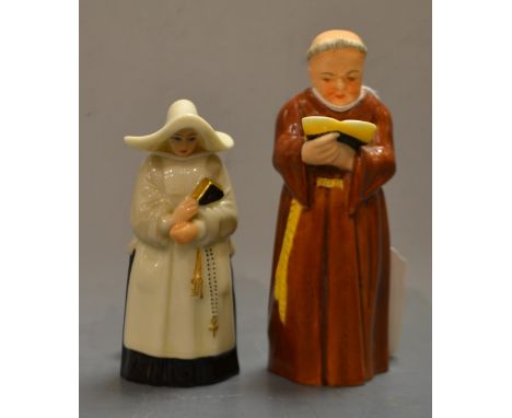 A Royal Worcester candlesnuffer, Nun, in habit and wimple clutching a prayer book, 9.5cm high, printed crown and circle mark 