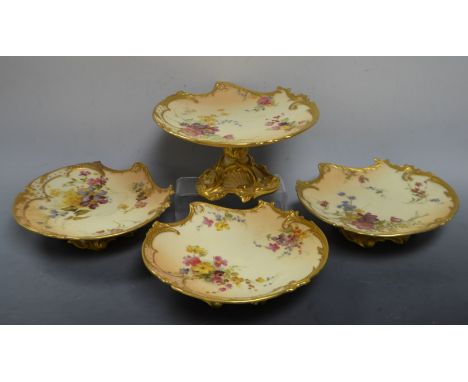 A Royal Worcester Empress part dessert service, comprising three footed shaped comports and a tall comport, each printed and 