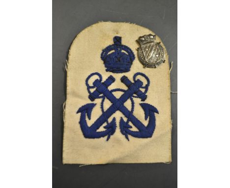 A minesweeper and anti submarine sleeve patch and silver badge