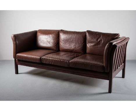  A ROSEWOOD FRAMED AND TANNED LEATHER UPHOLSTERED THREE SEAT SOFA, DANISH, with splayed slatted supports, on square legs, 192