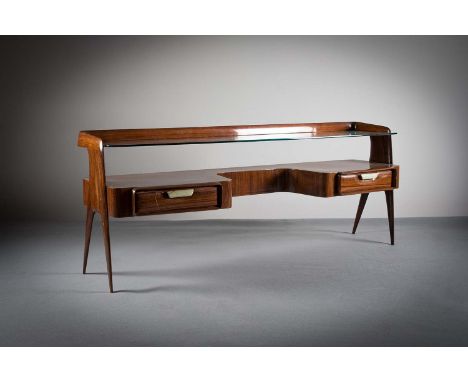 A ROSEWOOD DRESSING TABLE, ITALIAN, 1950s, with glass shelf, the shaped back on twin tapeing fork legs, 156cm (w) x 62cm (h) 