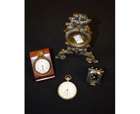 A late 19th century open face ladies pocket watch, silver case marked .935, enamel dial, Roman numerals, wooden stand; anothe