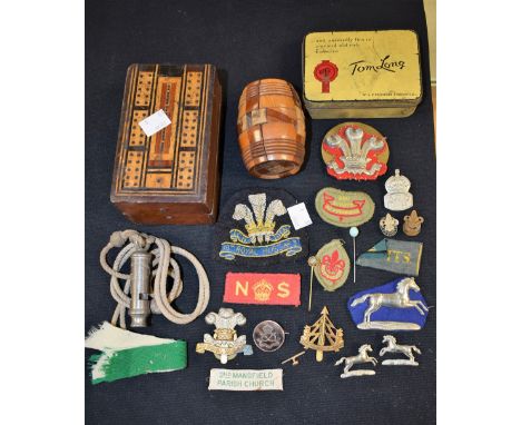Treen - a folding cribbage board; a barrel shaped puzzle; a quantity of military badges; a whistle etc