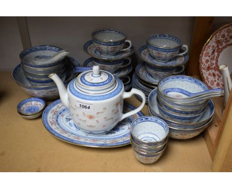 A Chinese blue and white dragon and clouds tea service inc tea bowls, stands, teapot, milk jug etc qty   Condition Report:  G