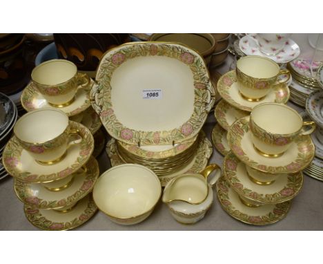 A Grosvenor gilt and floral part tea set comprising sandwich plates, side plates, sugar bowl, cream jug, cups and saucers