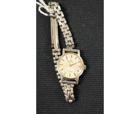 Omega - a ladies Geneve bracelet watch, brushed sunburst silvered dial, block batons, 485 cal 17 jewel manual wind movement, 