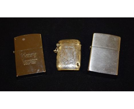 A hallmarked silver vesta lighter; a Zippo lighter; a Ronson Fury (3)