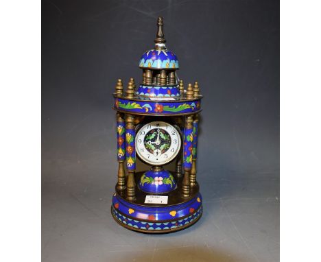 A cloisonne portico clock, domed top supported by six columns, ornamental dial, ball feet