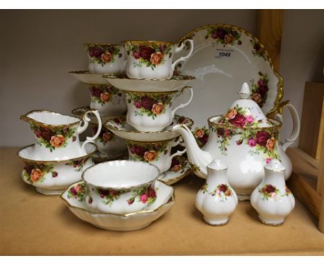 Royal Albert Old Country Roses - a tea service comprising six cups and saucers, teapot, sugar bowls, cruet, milk jug, bread a