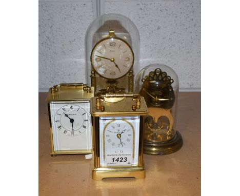 A Kern torsion clock with glass dome; a German skeleton clock; others, carriage clocks (4)