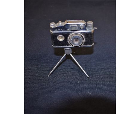 A KKW Camera tabletop lighter, with compass