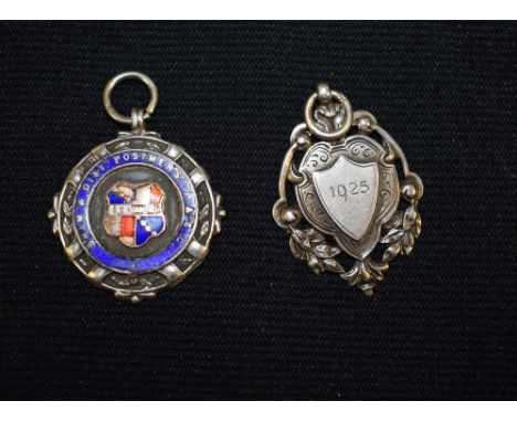 A silver and enamel postmans medallion; another, football medallion