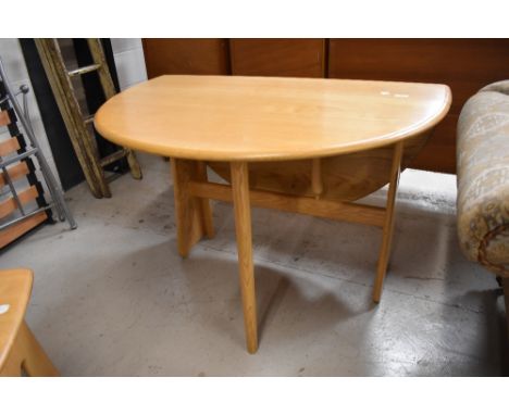 A modern Ercol light ash gateleg table, 1156