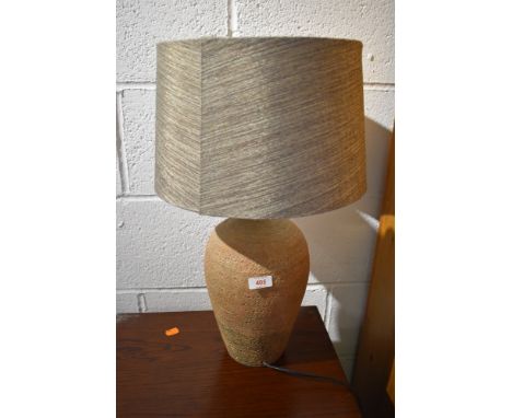 A pottery table lamp, with complimentary shade