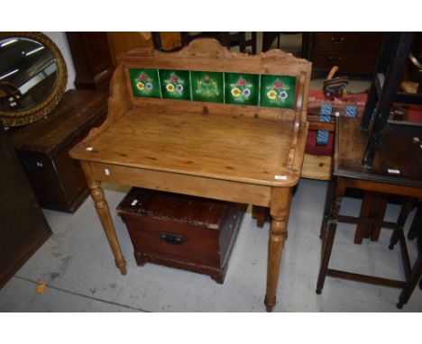 A 19th Century pine washstand having tile back