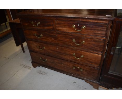 A 19th Century mahogany chest of two other three drawers having brass drop handles and bracket feet