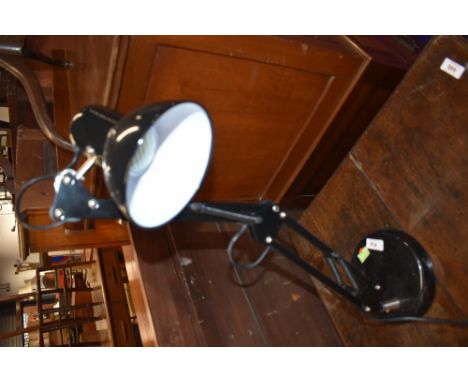 A traditional angle poise lamp
