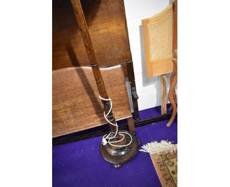 A traditional mahogany standard lamp