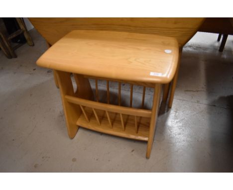 A modern light ash Ercol magazine table, 1153