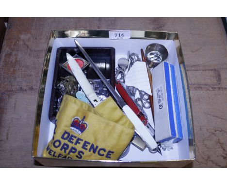 A box containing a Civil Defence Corps Welfare badge, various stationery, a harmonica etc. 