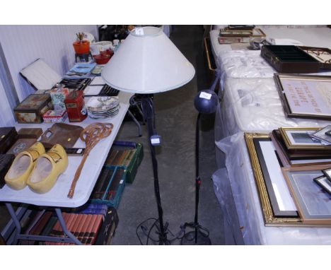 A wrought metal standard lamp and one other