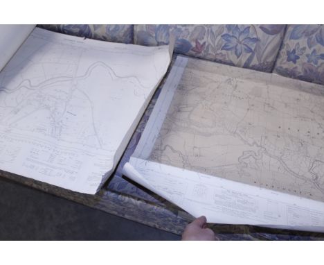A quantity of unframed rolled Ordnance Survey maps