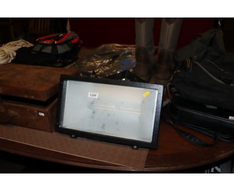 A Power outdoor flood light with mounting brackets 