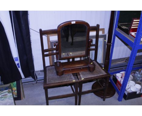 A pair of Edwardian cane seated bedroom chairs; a Victorian mahogany swing toilet mirror; a standard lamp and two shades; and