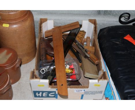 A box of various small hand tools and accessories 