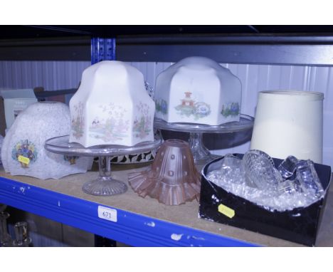 A collection of various glassware to include light shades, cake stands, decanters toppers etc.
